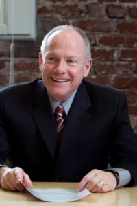 Happy chairman headshot image